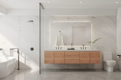 a bathroom with a tub, sink, and mirror